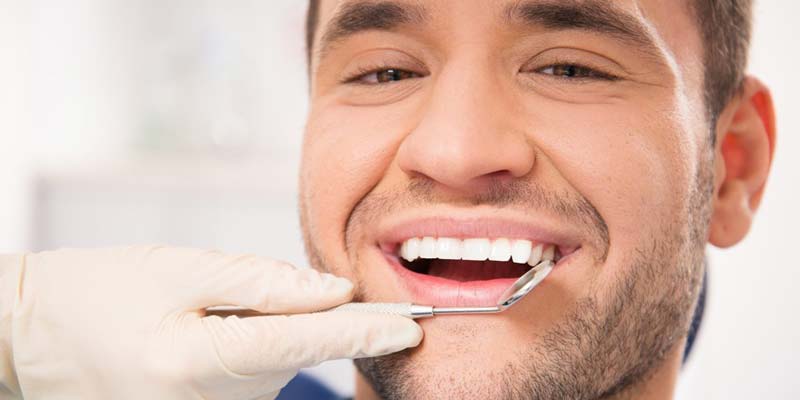 Male Getting Dental Oral Cancer Check